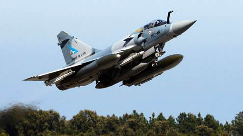 Qaddafi’s tanks elude airstrikes